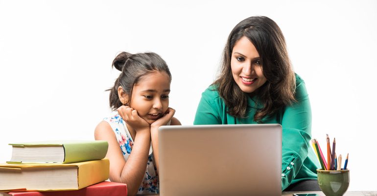 indian-girl-studying-with-mother-teacher-study-table-with-laptop-computer-books-having-fun-learning-qn4xuzeuqm485rj5qtiic7d7eny3bzkzk2h194gheo